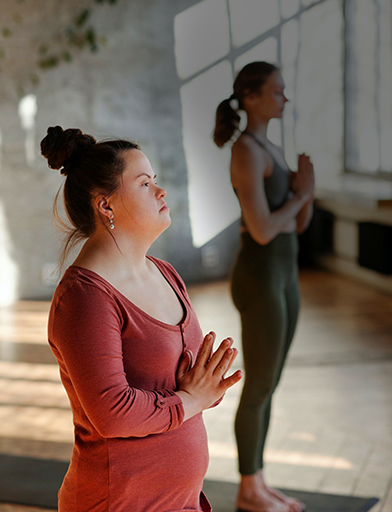 Female doing a yoga pose in a studio